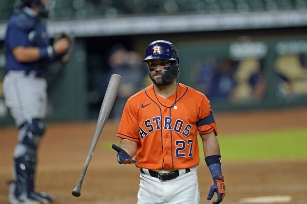 Houston Astros' Jose Altuve flips his bat after striking out against the Seattle Mariners during the seventh inning of a baseball game Friday, Aug. 14, 2020, in Houston. (AP Photo/David J. Phillip)