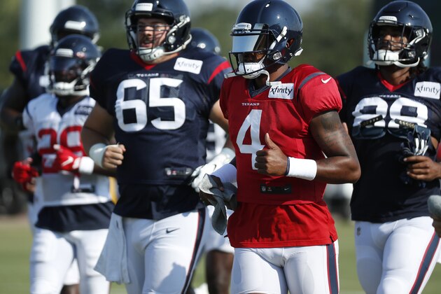 Houston Texans quarterback Deshaun Watson (4) jogs across the field with his teammates during an NFL training camp football practice Sunday, Aug. 23, 2020, in Houston. (Brett Coomer/Houston Chronicle via AP, Pool)