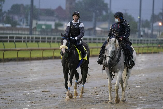 Kentucky Derby entry Honor A. P. Is lead off the track following a workout at Churchill Downs, Thursday, Sept. 3, 2020, in Louisville, Ky. The Kentucky Derby is scheduled for Saturday, Sept. 5th. (AP Photo/Darron Cummings)