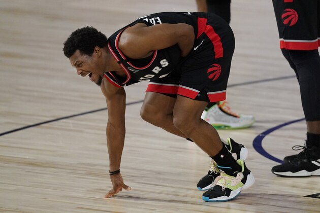 Toronto Raptors' Kyle Lowry (7) grimaces after being kicked in the second half of an NBA conference semifinal playoff basketball game against the Boston Celtics Thursday, Sept 3, 2020, in Lake Buena Vista Fla. (AP Photo/Mark J. Terrill)