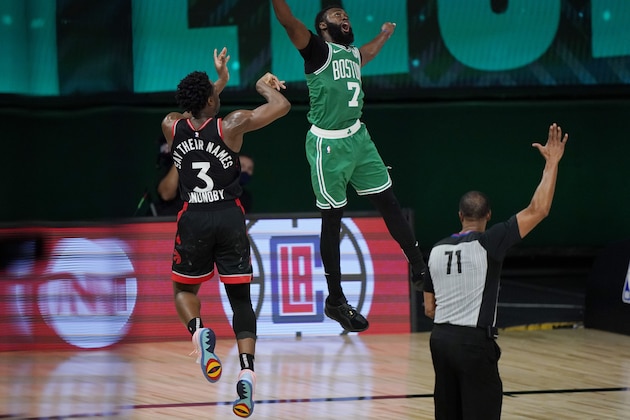 Toronto Raptors' OG Anunoby (3) releases a game-winning shot at the buzzer over Boston Celtics' Jaylen Brown (7) in the second half of an NBA conference semifinal playoff basketball game Thursday, Sept 3, 2020, in Lake Buena Vista Fla. (AP Photo/Mark J. Terrill)