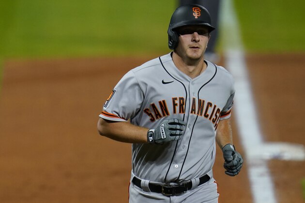 San Francisco Giants left fielder Alex Dickerson (12) in the sixth inning of a baseball game Tuesday, Sept. 1, 2020, in Denver. (AP Photo/David Zalubowski)