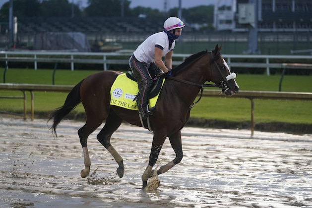 Kentucky Derby entry Tiz the Law runs during a workout at Churchill Downs, Wednesday, Sept. 2, 2020, in Louisville, Ky. The 146th running of the Kentucky Derby is scheduled for Saturday, Sept. 5th. (AP Photo/Darron Cummings)