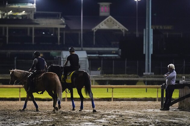 Trainer Bob Baffert watches as Kentucky Derby entry Thousand Words walks onto the track during a workout at Churchill Downs, Friday, Sept. 4, 2020, in Louisville, Ky. The Kentucky Derby is scheduled for Saturday, Sept. 5th. (AP Photo/Darron Cummings)