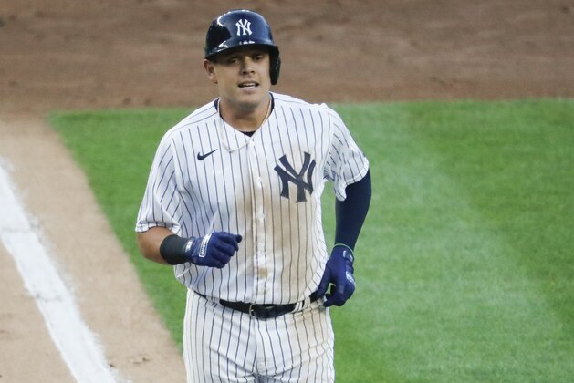 New York Yankees' Gio Urshela runs the bases after hitting a grand slam off Boston Red Sox starting pitcher Zack Godley in the first inning of a baseball game, Saturday, Aug. 1, 2020, in New York. (AP Photo/John Minchillo)