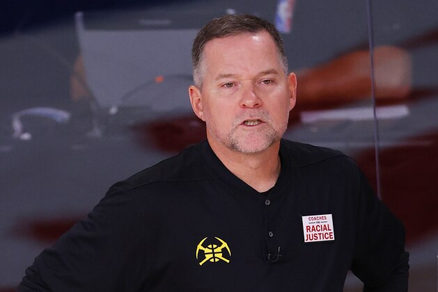 Denver Nuggets head coach Michael Malone looks on Game 3 of an NBA basketball first-round playoff series against the Utah Jazz, Friday, Aug. 21, 2020, in Lake Buena Vista, Fla. (Mike Ehrmann/Pool Photo via AP)