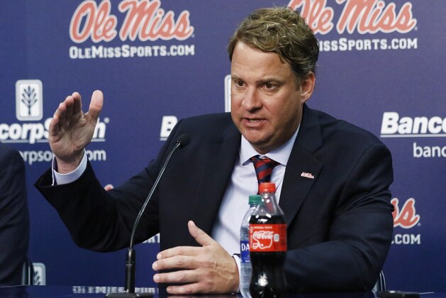Lane Kiffin responds to reporters questions at a news conference, after being introduced to Mississippi fans as their new NCAA college football coach, at The Pavilion, a multipurpose arena on the campus in Oxford, Miss., Monday, Dec. 9, 2019. Kiffin was previously, the football coach for three years at Florida Atlantic. (AP Photo/Rogelio V. Solis)