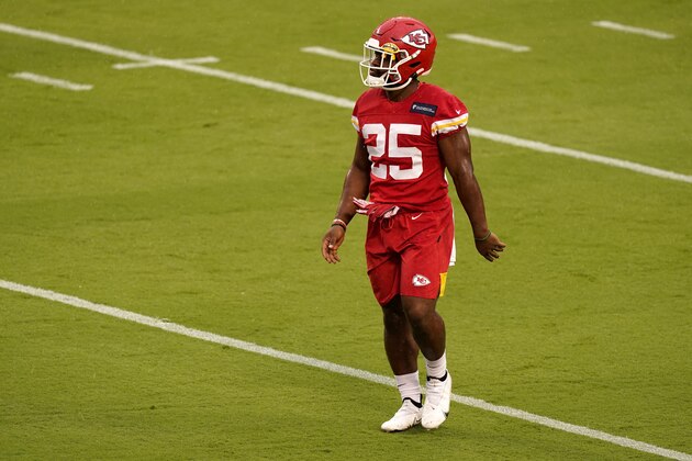 Kansas City Chiefs running back Clyde Edwards-Helaire (25) watches a drill during an NFL football training camp Saturday, Aug. 29, 2020, at Arrowhead Stadium in Kansas City, Mo. The Chiefs opened the stadium to 5,000 season ticket holders to watch practice as the team plans to open the regular season with a reduced capacity of approximately 22 percent of normal attendance. (AP Photo/Charlie Riedel)