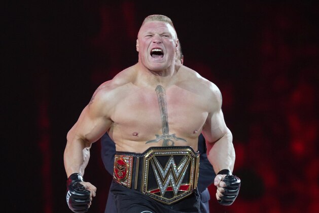 FILE - In this March 29, 2015, file photo, Brock Lesnar makes his entrance at Wrestlemania XXXI in Santa Clara, Calif. UFC 200 has grown so big that a single show can’t contain it. The mixed martial arts promotion is throwing an “International Fight Week” in Las Vegas with compelling shows on three consecutive nights, culminating in the star-studded pay-per-view event Saturday. Jon Jones meets light heavyweight champion Daniel Cormier in the main event of a card also featuring the return of former heavyweight champ Brock Lesnar. (AP Photo/Don Feria, File)