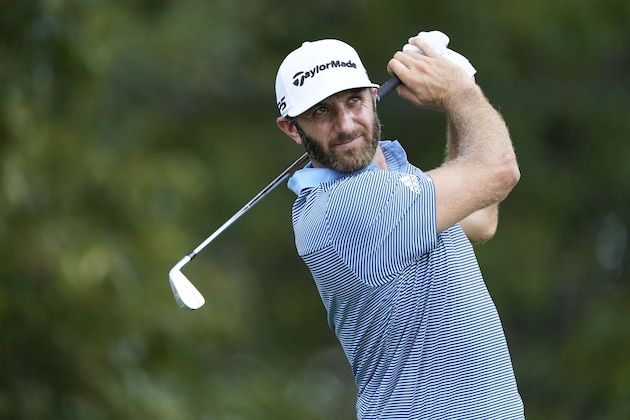 Dustin Johnson hits on the third tee during the first round of the Tour Championship golf tournament at East Lake Golf Club in Atlanta, Friday, Sept. 4, 2020. (AP Photo/John Bazemore)