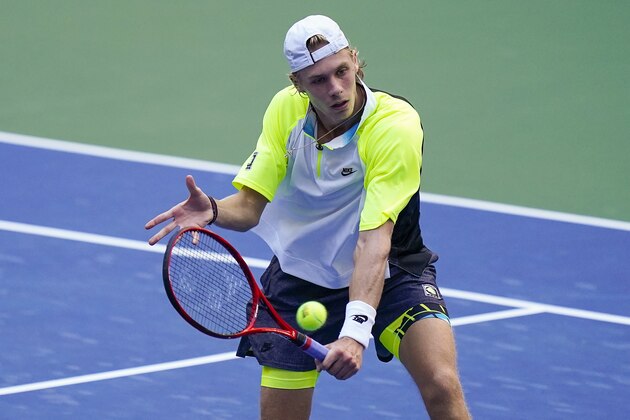 Denis Shapovalov, of Canada, returns a shot to Taylor Fritz, of the United States, during the third round of the US Open tennis championships, Friday, Sept. 4, 2020, in New York. (AP Photo/Seth Wenig)