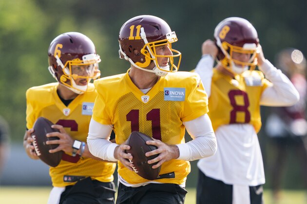 Washington quarterbacks Steven Montez (6), Alex Smith (11) and Kyle Allen (8) work during practice at the team's NFL football training facility, Tuesday, Aug. 25, 2020, in Ashburn, Va. (AP Photo/Alex Brandon)