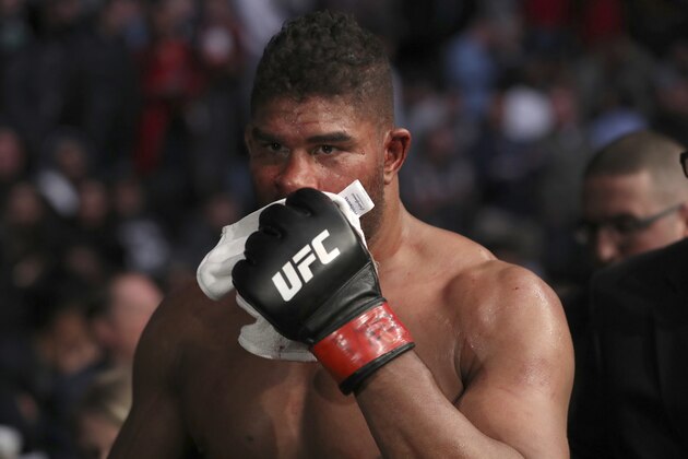 EDS NOTE-GRAPHIC CONTENT. Alistair Overeem walks back to the locker room with a cut lip after being TKOd by Jairzinho Rozenstruik in their heavyweight mixed martial arts bout at UFC Fight Night, Sunday, December 8, 2019, in Washington, D.C. Rozenstruik won via 5th round TKO. (AP Photo/Gregory Payan)