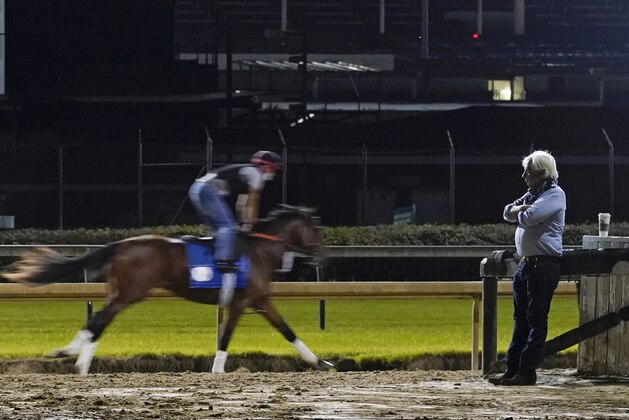 Trainer Bob Baffert watches at horses workout at Churchill Downs, Friday, Sept. 4, 2020, in Louisville, Ky. The Kentucky Derby is scheduled for Saturday, Sept. 5th. (AP Photo/Darron Cummings)