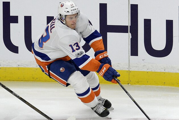 New York Islanders center Matthew Barzal (13) skates with the puck during the third period of an NHL preseason hockey game against the Buffalo Sabres, Friday, Sept. 29, 2017, in Buffalo, N.Y. New York beat Buffalo 3-1. (AP Photo/Adrian Kraus)