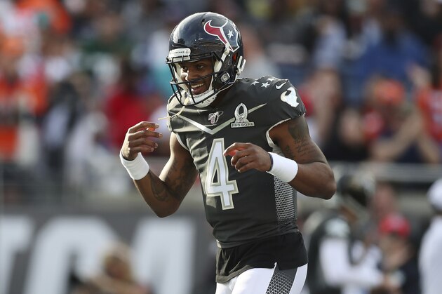 AFC quarterback Deshaun Watson, of the Houston Texans, reacts after scoring a touchdown during the NFL Pro Bowl football game against the NFC, Sunday, Jan. 26, 2020, in Orlando, Fla. (AP Photo/Steve Luciano)