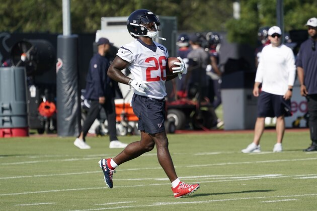 Houston Texans running back Lamar Miller (26) carries the ball during an NFL football training camp practice Thursday, July 25, 2019, in Houston. (AP Photo/David J. Phillip)
