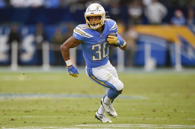 FILE - In this Dec. 22, 2019, file photo, Los Angeles Chargers running back Austin Ekeler runs against the Oakland Raiders during the second half of an NFL football game in Carson, Calif. Ekeler could be the one player who benefits the most from the Los Angeles Chargers changes on offense. (AP Photo/Kelvin Kuo, File)