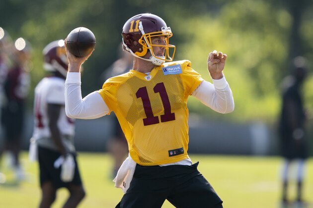 Washington quarterback Alex Smith (11) throws the ball during practice at the team's NFL football training facility, Tuesday, Aug. 25, 2020, in Ashburn, Va. (AP Photo/Alex Brandon)