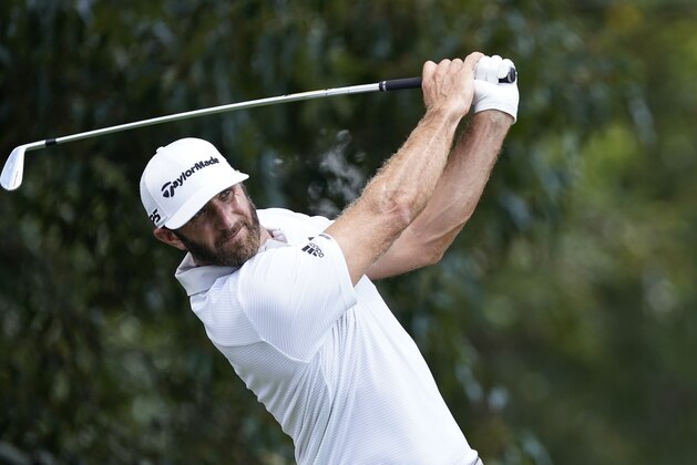 Dustin Johnson hits from the tee on the third hole during the second round of the Tour Championship golf tournament at East Lake Golf Club in Atlanta, Saturday, Sept. 5, 2020. (AP Photo/John Bazemore)