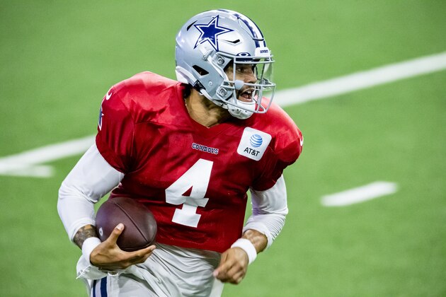 Dallas Cowboys quarterback Dak Prescott hurries out of the pocket during an NFL football training camp practice at The Star, Friday, Aug. 28, 2020, in Frisco, Texas. (AP Photo/Brandon Wade)