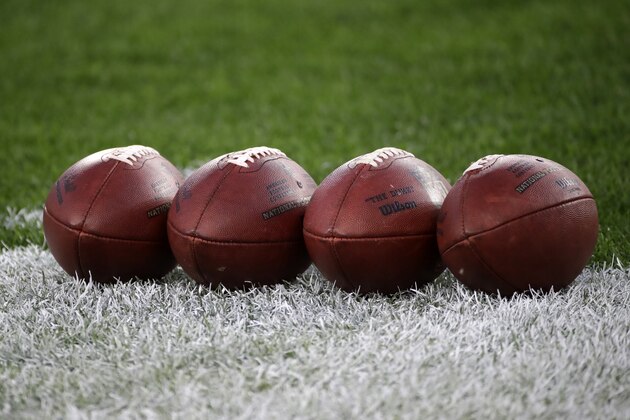 NFL Wilson footballs sit on the field during warmups before an NFL football game between the Pittsburgh Steelers and the Cincinnati Bengals at Heinz Field in Pittsburgh, Monday, Sept. 30, 2019. (AP Photo/Don Wright)