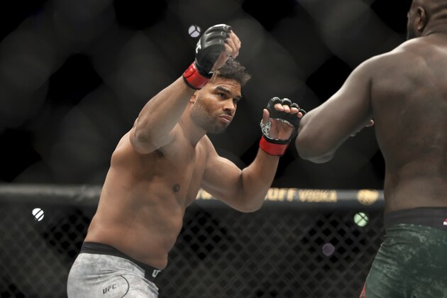 Alistair Overeem, left, in action against Jairzinho Rozenstruik during their heavyweight mixed martial arts bout at UFC Fight Night, Sunday, December 8, 2019, in Washington, D.C. Rozenstruik won via 5th round TKO. (AP Photo/Gregory Payan)