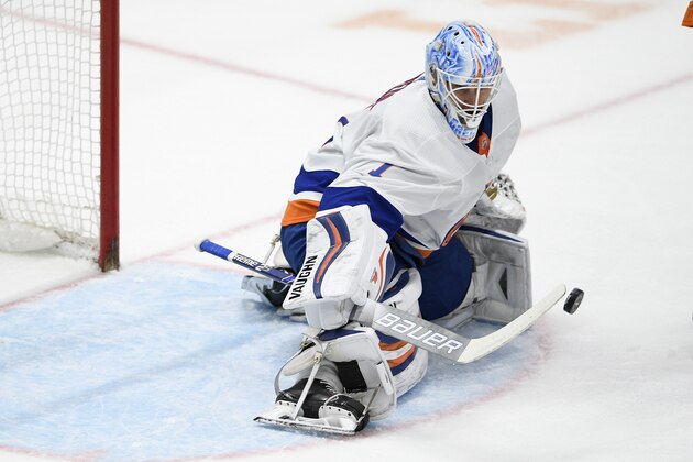 New York Islanders goaltender Thomas Greiss (1) stops the puck during the first period of an NHL hockey game against the Washington Capitals, Monday, Feb. 10, 2020, in Washington. (AP Photo/Nick Wass)