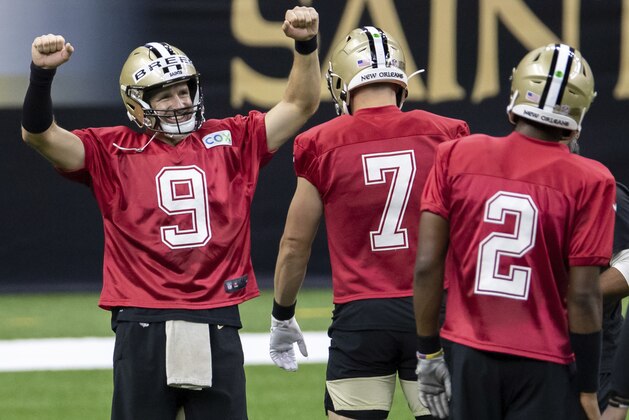 New Orleans Saints quarterback Drew Brees (9) reacts to beating the other quarterbacks to the tape during NFL football training camp Saturday, Aug. 29, 2020, in New Orleans. (David Grunfeld/The Advocate via AP, Pool)