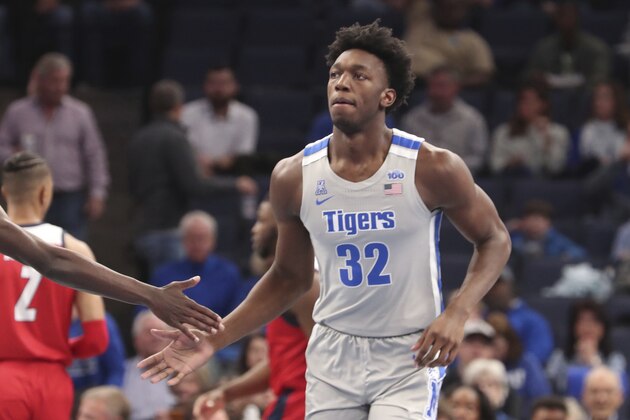 Memphis' James Wiseman (32) is congratulated between plays in an NCAA college basketball game against University of Illinois-Chicago Saturday, Nov. 9, 2019, in Memphis, Tenn. (AP Photo/Karen Pulfer Focht)