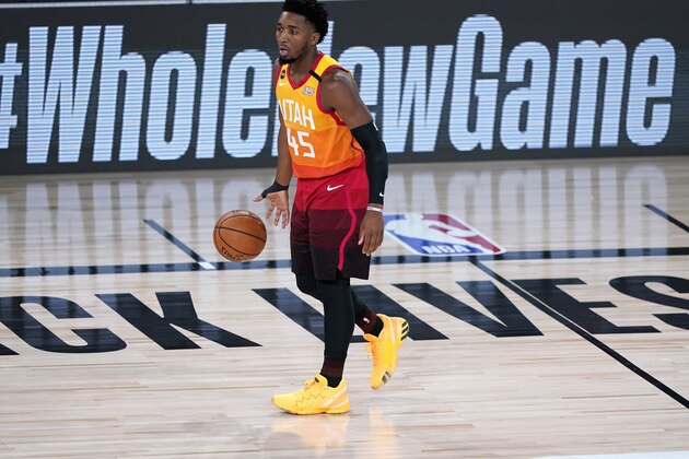Utah Jazz's Donovan Mitchell (45) moves the ball up court against the Denver Nuggets during the first half of an NBA basketball first round playoff game Friday, Aug. 21, 2020, in Lake Buena Vista, Fla. (AP Photo/Ashley Landis, Pool)