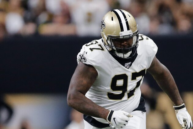 Minnesota Vikings running back Alexander Mattison (25) carries against New Orleans Saints defensive tackle Malcom Brown (90), defensive tackle David Onyemata (93), defensive end Mario Edwards (97) and cornerback Janoris Jenkins (20) in the first half of an NFL wild-card playoff football game, Sunday, Jan. 5, 2020, in New Orleans. (AP Photo/Brett Duke)