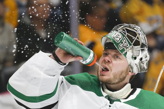 Dallas Stars goaltender Anton Khudobin, of Kazakhstan, takes a drink in the second period of an NHL hockey game against the Nashville Predators Thursday, March 5, 2020, in Nashville, Tenn. (AP Photo/Mark Humphrey)