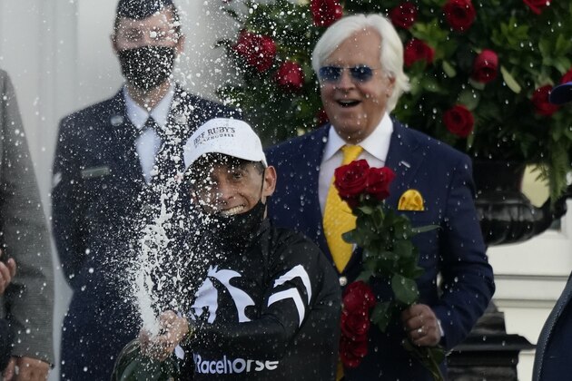John Velazquez celebrates after riding Authentic to victory in the 146th running of the Kentucky Derby at Churchill Downs, Saturday, Sept. 5, 2020, in Louisville, Ky. (AP Photo/Jeff Roberson)