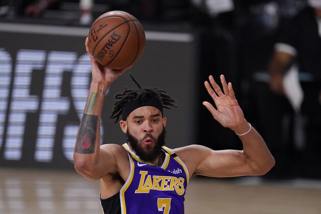 Los Angeles Lakers' JaVale McGee passes the ball during the second half of an NBA conference semifinal playoff basketball game against the Houston Rockets Friday, Sept. 4, 2020, in Lake Buena Vista, Fla. (AP Photo/Mark J. Terrill)