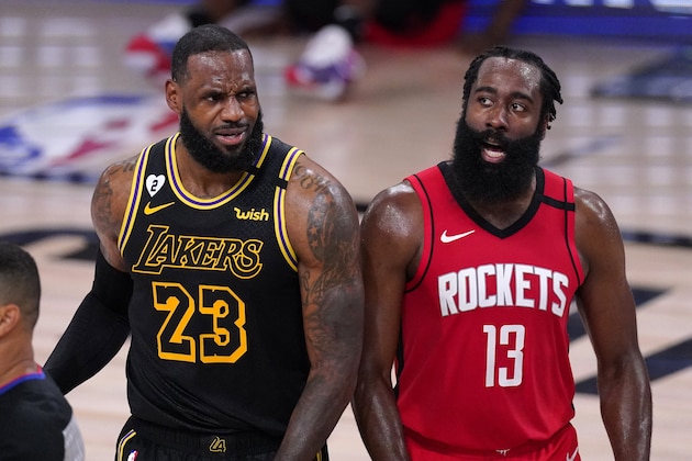 Los Angeles Lakers' LeBron James (23) and Houston Rockets' James Harden (13) react to a call during the second half of an NBA conference semifinal playoff basketball game Sunday, Sept. 6, 2020, in Lake Buena Vista, Fla. (AP Photo/Mark J. Terrill)