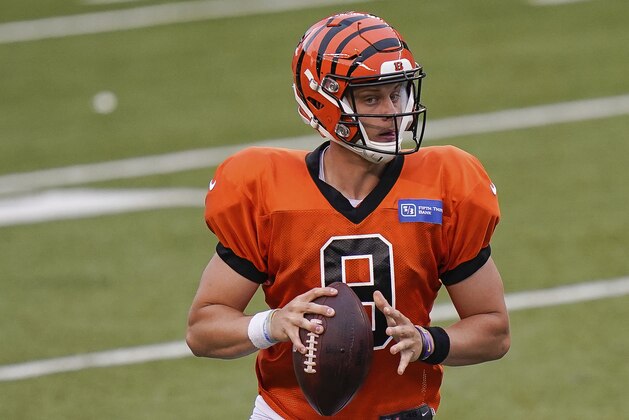 Cincinnati Bengals quarterback Joe Burrow (9) scrambles with the ball during an NFL football team scrimmage in Cincinnati, Sunday, Aug. 30, 2020. (AP Photo/Bryan Woolston)