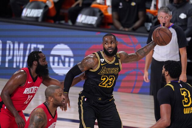 Los Angeles Lakers' LeBron James (23) looks to pass during the first half of an NBA conference semifinal playoff basketball game against the Houston Rockets Sunday, Sept. 6, 2020, in Lake Buena Vista, Fla. (AP Photo/Mark J. Terrill)