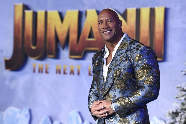 Cast member Dwayne Johnson poses for photographers at the Los Angeles premiere of