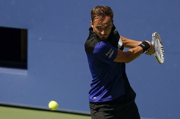 Daniil Medvedev, of Russia, returns a shot to J.J. Wolf, of the United States, during the third round of the US Open tennis championships, Saturday, Sept. 5, 2020, in New York. (AP Photo/Seth Wenig)