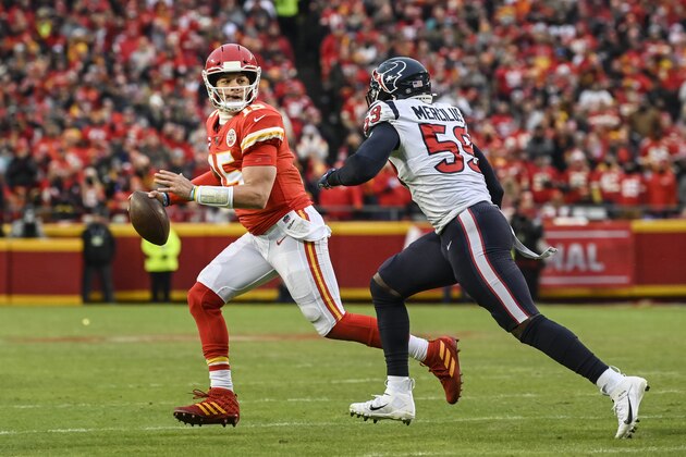 Kansas City Chiefs quarterback Patrick Mahomes (15) scrambles away from Houston Texans outside linebacker Whitney Mercilus (59) during the second half of an NFL football game in Kansas City, Mo., Sunday, Jan. 12, 2020. (AP Photo/Reed Hoffmann)