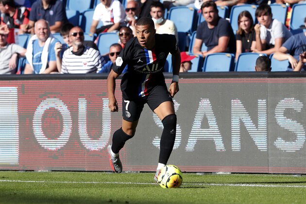 Paris Saint Germain's Kylian Mbappe controls the ball during a friendly soccer match between Paris Saint Germain and Le Havre, in Le Havre, western France, Sunday, July 12, 2020. (AP Photo/Thibault Camus)