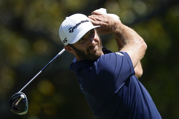 Dustin Johnson hits his tee shot on the fifth hole during the final round of the Tour Championship golf tournament at East Lake Golf Club in Atlanta, Monday, Sept. 7, 2020. (AP Photo/John Bazemore)