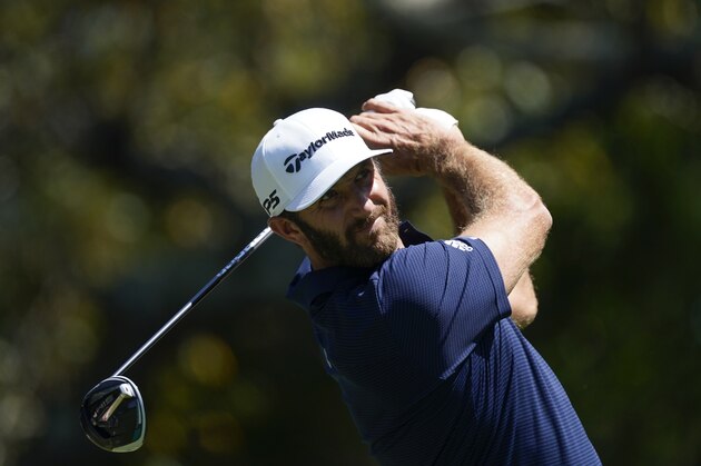 Dustin Johnson hits his tee shot on the fifth hole during the final round of the Tour Championship golf tournament at East Lake Golf Club in Atlanta, Monday, Sept. 7, 2020. (AP Photo/John Bazemore)