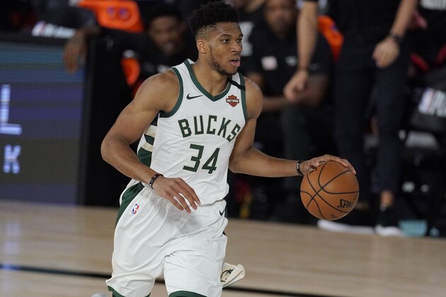 Milwaukee Bucks' Giannis Antetokounmpo (34) in the second half of an NBA conference semifinal playoff basketball game against the Miami Heat Friday, Sept. 4, 2020, in Lake Buena Vista, Fla. (AP Photo/Mark J. Terrill)