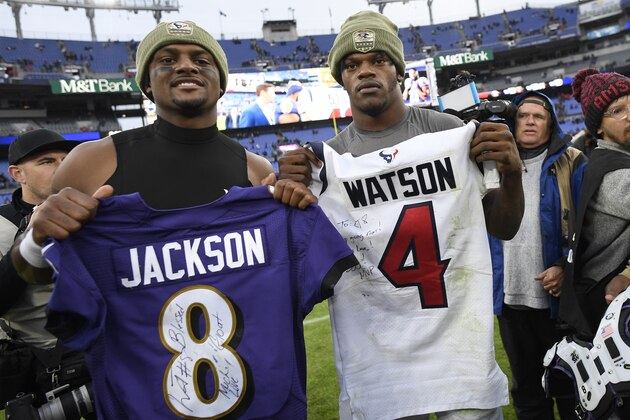 Houston Texans quarterback Deshaun Watson, left, and Baltimore Ravens quarterback Lamar Jackson pose for photographers after swapping jerseys after an NFL football game, Sunday, Nov. 17, 2019, in Baltimore. The Ravens won 41-7. (AP Photo/Nick Wass)