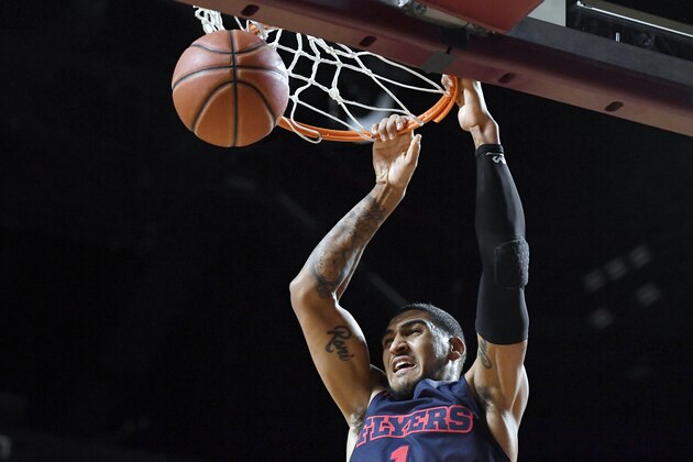 Dayton's Obi Toppin dunks the ball in the first half of an NCAA college basketball game against Massachusetts, Saturday, Feb. 15, 2020, in Amherst, Mass. (AP Photo/Jessica Hill)