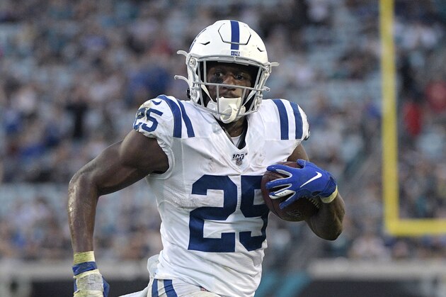 Indianapolis Colts running back Marlon Mack (25) rushes for an 8-yard touchdown during the first half of an NFL football game against the Jacksonville Jaguars Sunday, Dec. 29, 2019, in Jacksonville, Fla. (AP Photo/Phelan M. Ebenhack)