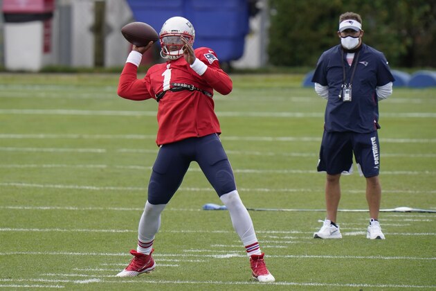 New England Patriots quarterback Cam Newton passes as offensive coordinator Josh McDaniels watches during an NFL football camp practice, Monday, Aug. 17, 2020, in Foxborough, Mass. (AP Photo/Steven Senne, Pool)