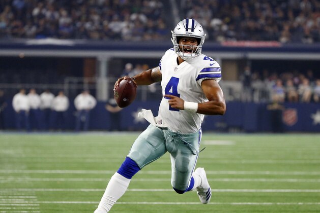 FILE - In this Aug. 18, 2018, file photo, Dallas Cowboys quarterback Dak Prescott (4) scrambles during the first half of a preseason NFL football game against the Cincinnati Bengals, in Arlington, Texas. Prescott dealt with the uncertainty of running back Ezekiel Elliott’s looming six-game suspension last year when the Dallas Cowboys slid from an NFC-best 13 wins to out of the playoffs. Now the star quarterback faces the unknown of a revamped and largely unproven group of receivers after the departures of Jason Witten and Dez Bryant. Elliott, Prescott’s fellow rookie standout from two years ago, is the supposed sure thing for a team looking up in the NFC East at defending Super Bowl champ Philadelphia.(AP Photo/Ron Jenkins, File)